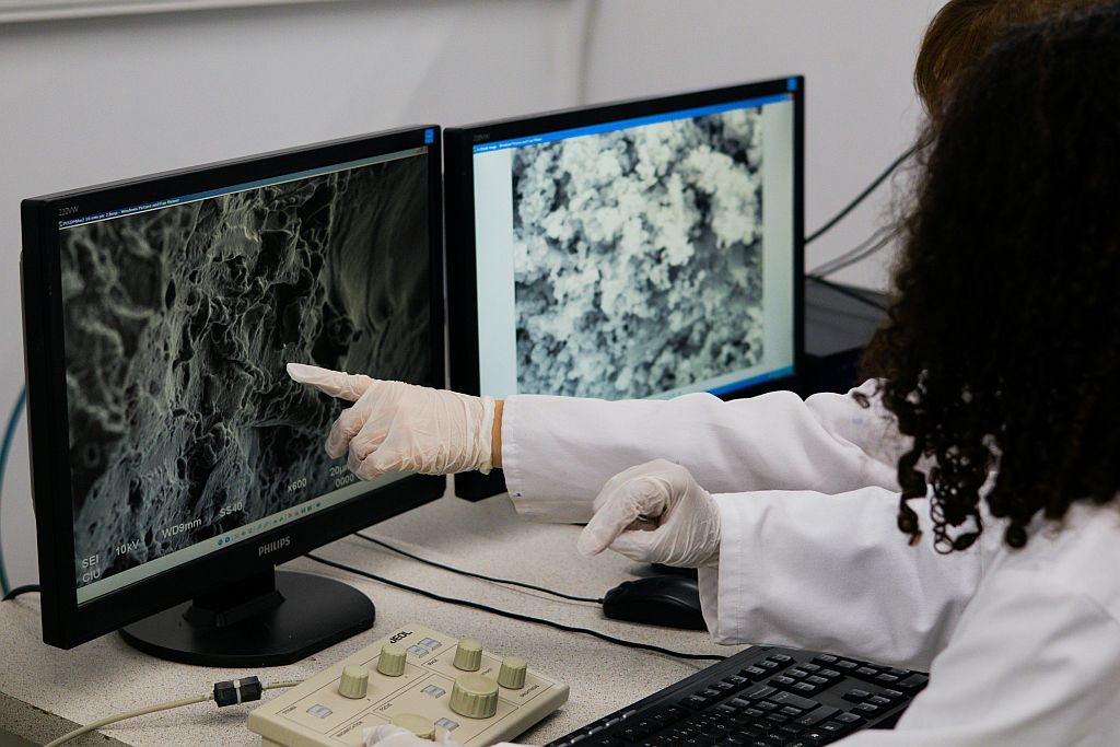 Scientist reviewing medical data in a laboratory